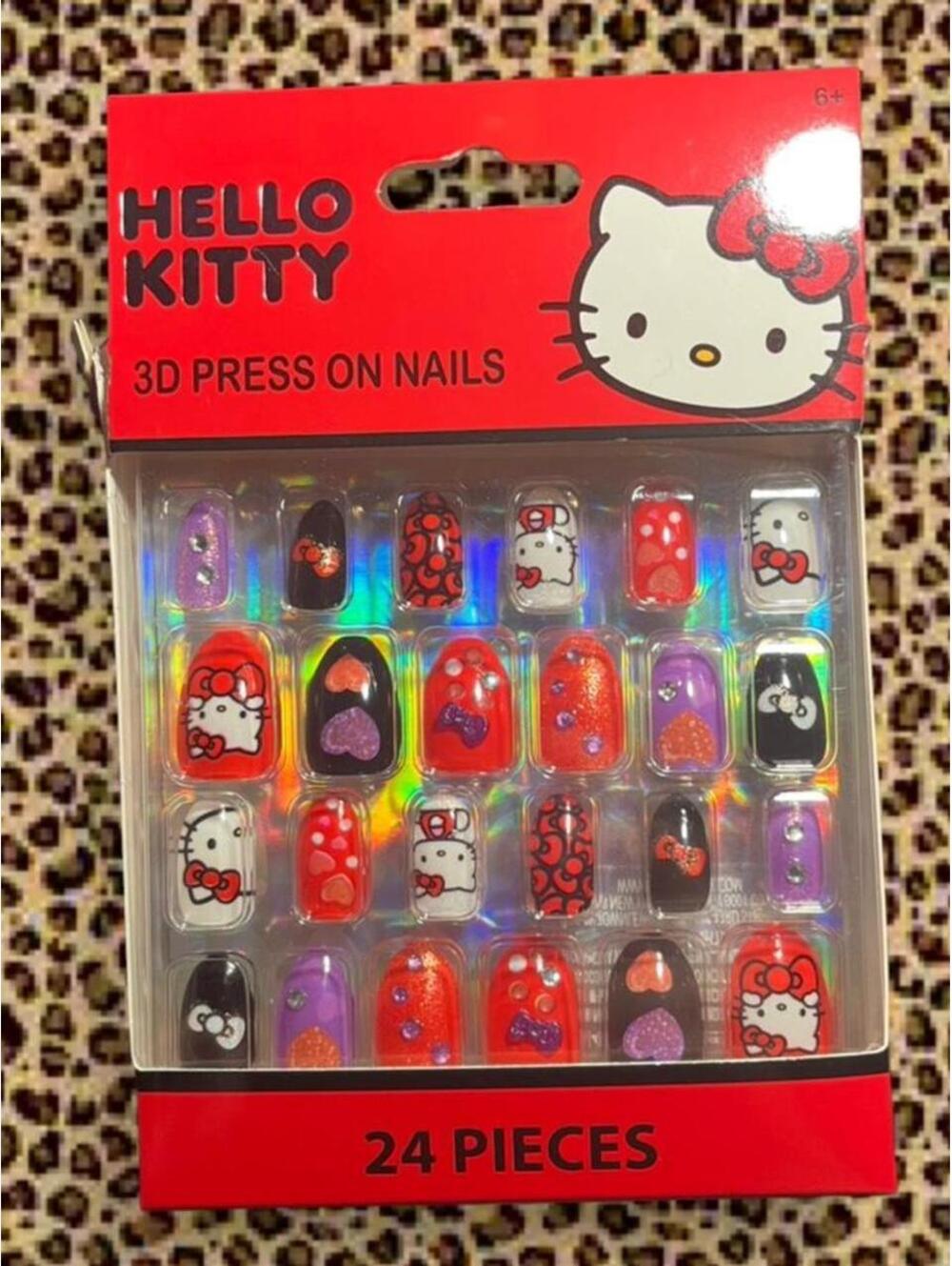 Glittery red and purple Hello Kitty press on nails
